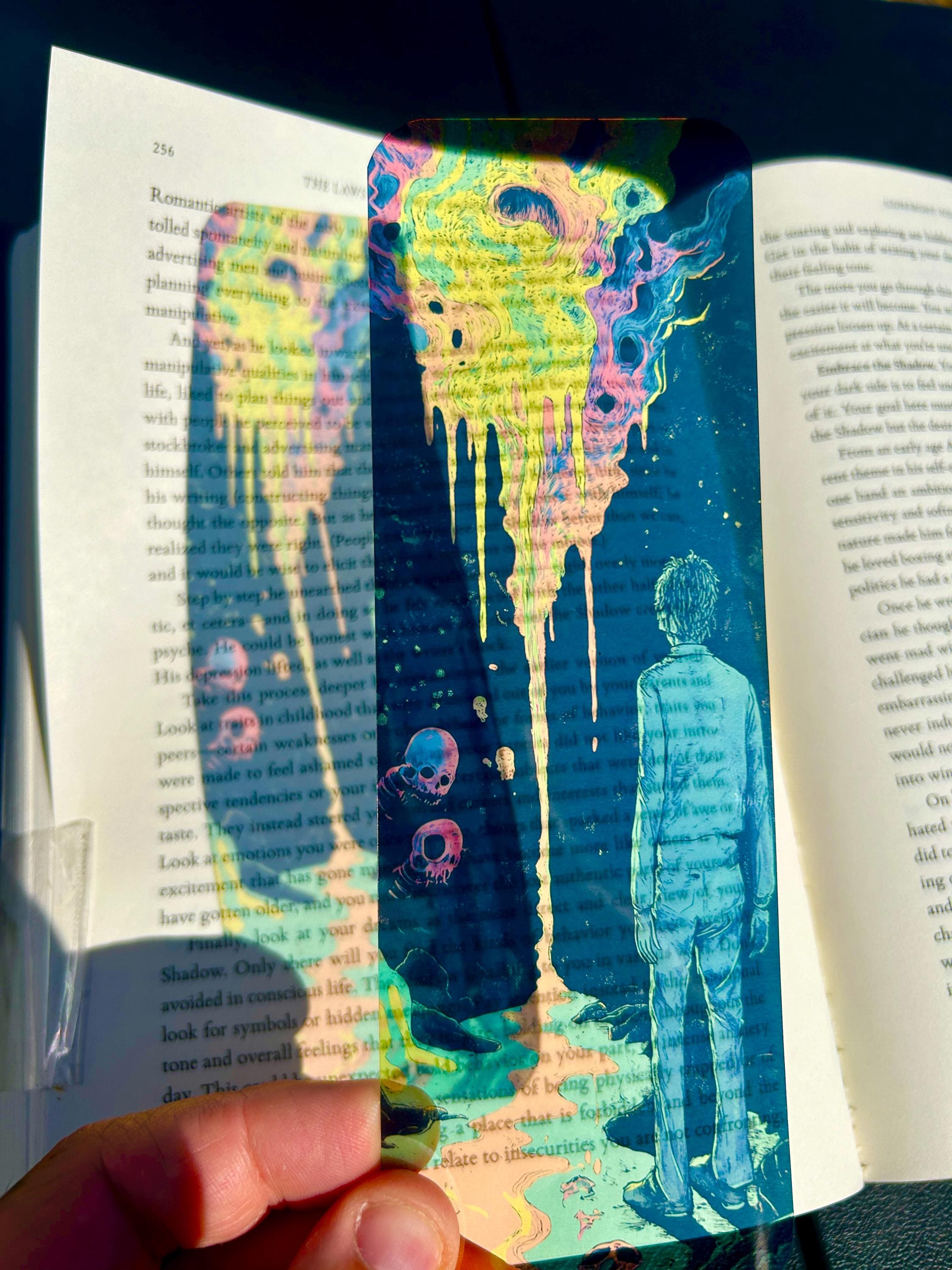 Claustrophobia in the Void Bookmark with Melting Nebula and Floating Skulls – Surreal Cosmic Horror Art