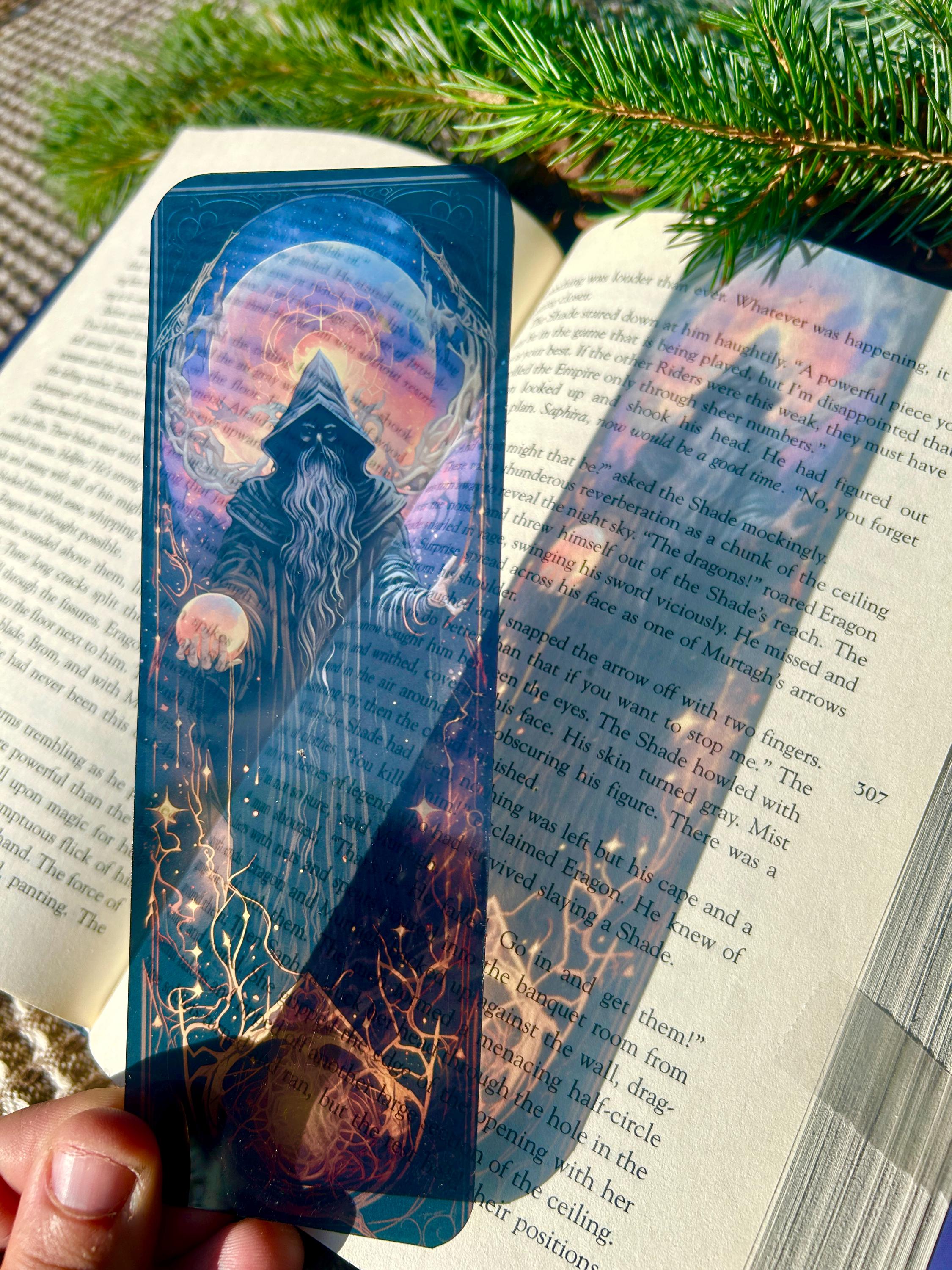 Dark Sorcerer Bookmark Gothic Fantasy Wizard Design with Glowing Orb, Mysterious Cloaked Figure in Hooded Robes, Transparent Bookmark