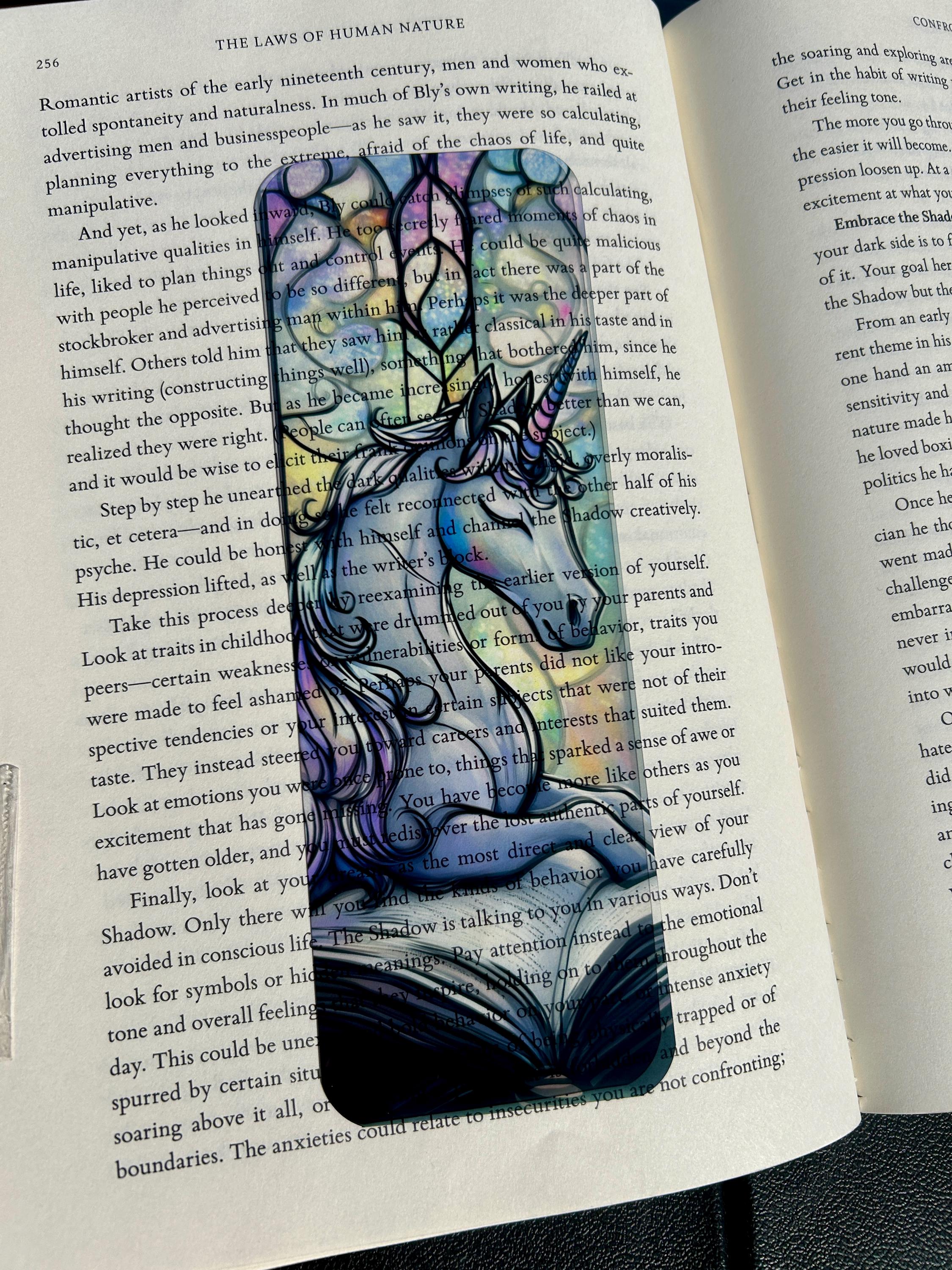Stained glass unicorn bookmark dreamy lilac unicorn resting beside an open storybook